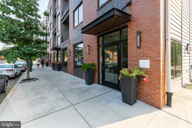 property entrance with brick siding