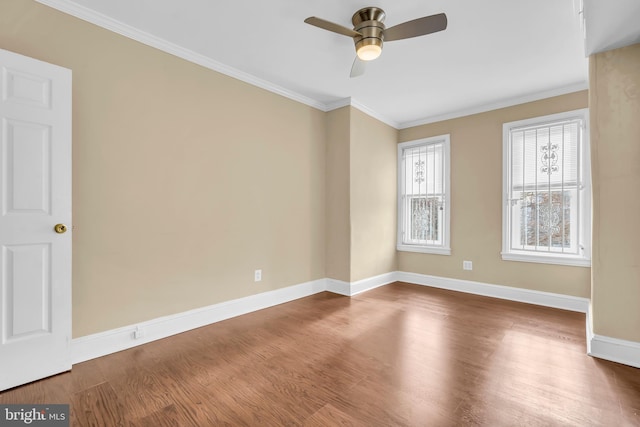 spare room with ceiling fan, wood-type flooring, and crown molding