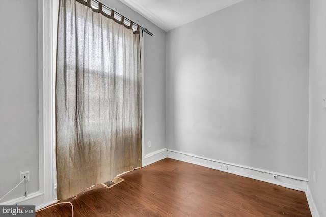 unfurnished room featuring hardwood / wood-style floors