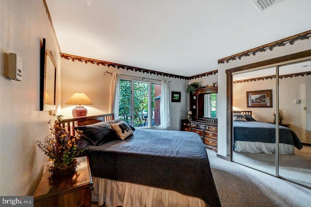 bedroom featuring a closet and carpet flooring