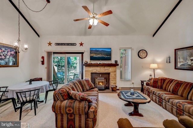 carpeted living room featuring a wood stove, baseboard heating, and ceiling fan with notable chandelier