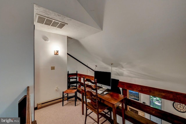 carpeted office space with lofted ceiling