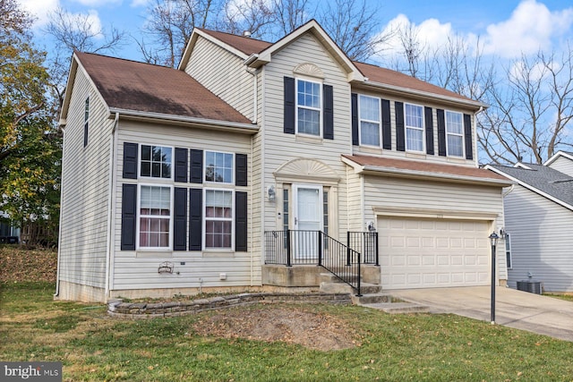 view of front of property featuring a garage, cooling unit, and a front yard