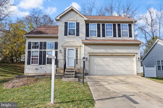 view of front facade with a front yard and a garage