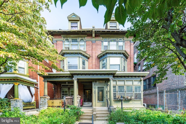 257-9 S 46th St, Philadelphia, PA 19139 - italianate home featuring covered porch and brick siding