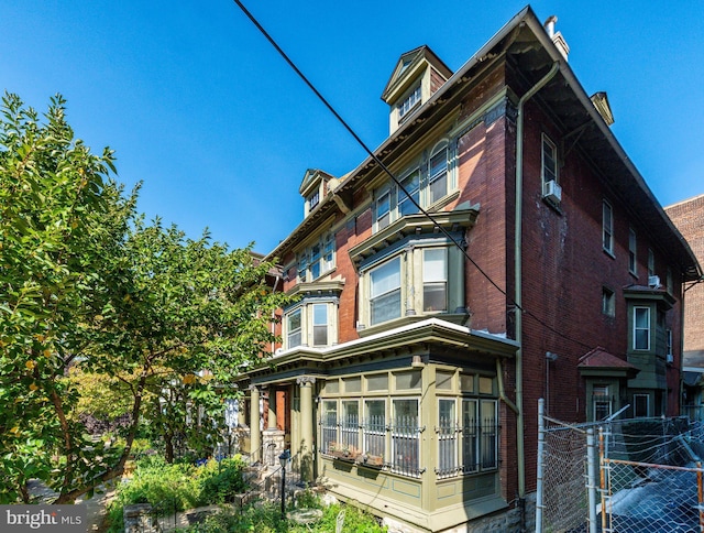 257-9 S 46th St, Philadelphia, PA 19139 - view of side of property featuring cooling unit, fence, and brick siding