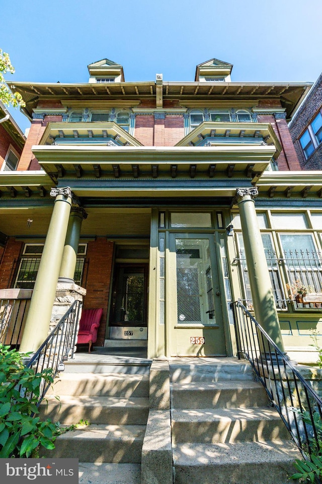 257-9 S 46th St, Philadelphia, PA 19139 - doorway to property with a porch and brick siding