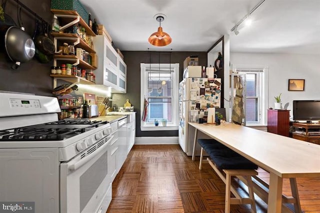 257-9 S 46th St, Philadelphia, PA 19139 - kitchen with open shelves, light countertops, track lighting, white appliances, and a peninsula