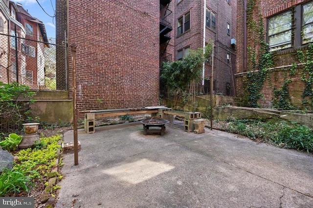 view of patio featuring an outdoor fire pit