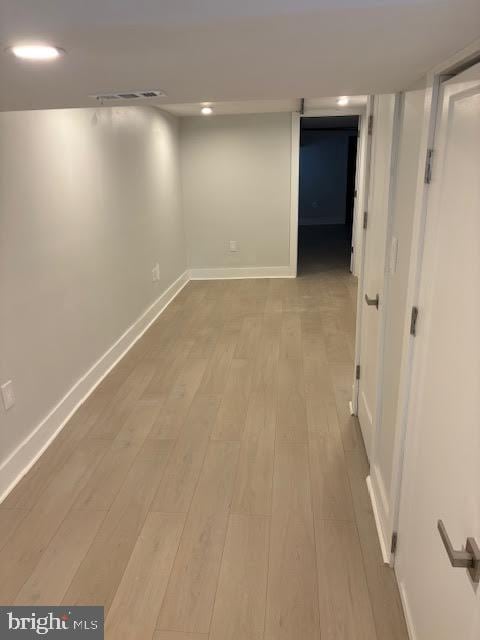 basement featuring light hardwood / wood-style flooring