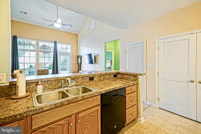 kitchen featuring sink, ceiling fan, light tile patterned flooring, vaulted ceiling, and dishwasher