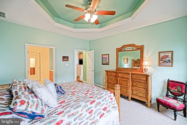 bedroom featuring ceiling fan, a raised ceiling, crown molding, and light carpet