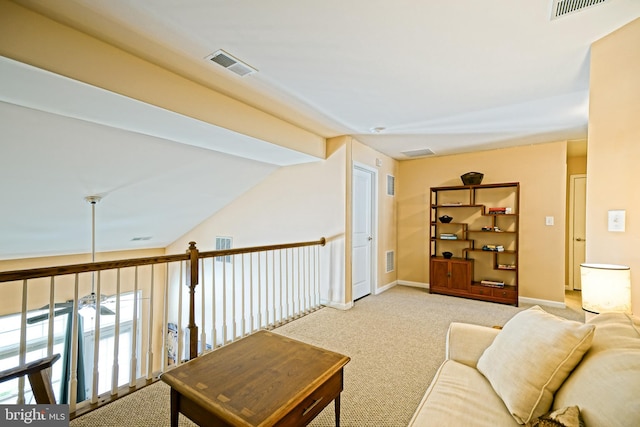 living room with vaulted ceiling, ceiling fan, and light colored carpet