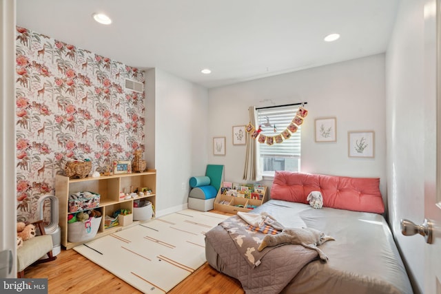 bedroom featuring recessed lighting, visible vents, baseboards, and wood finished floors