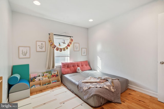 bedroom featuring recessed lighting, baseboards, and wood finished floors