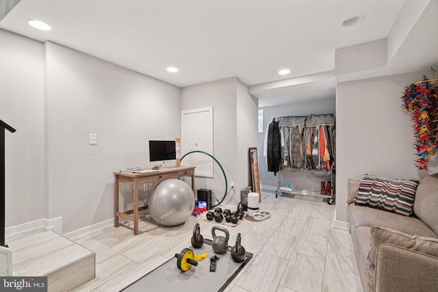 workout area with recessed lighting and baseboards