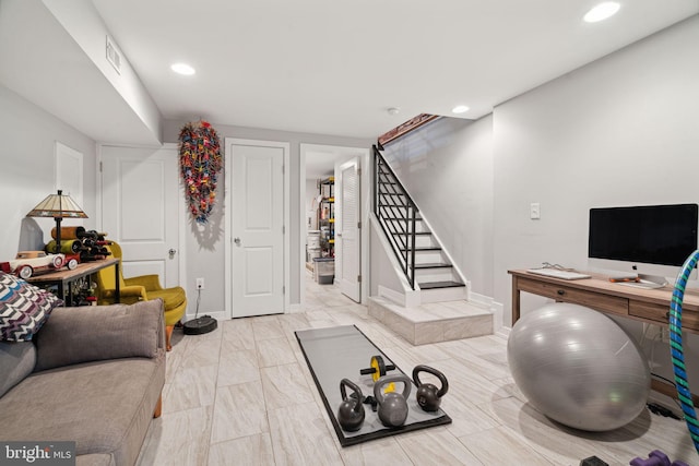 exercise room with recessed lighting, visible vents, and baseboards