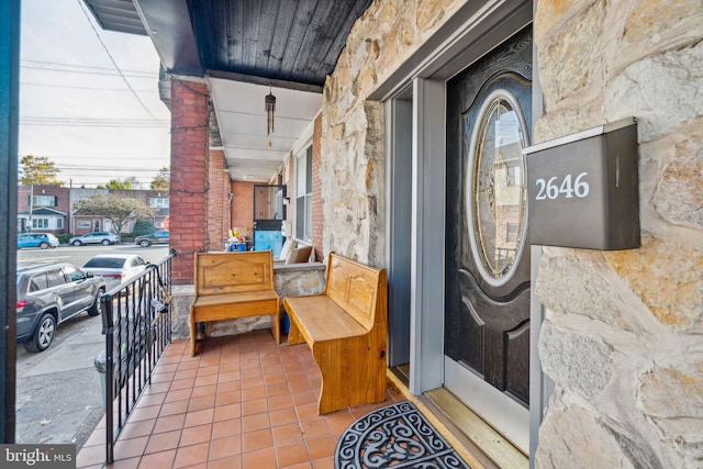 doorway to property with a porch