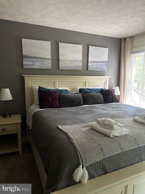 bedroom featuring a textured ceiling