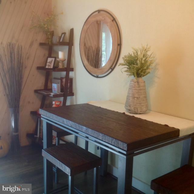 dining area with dark hardwood / wood-style floors