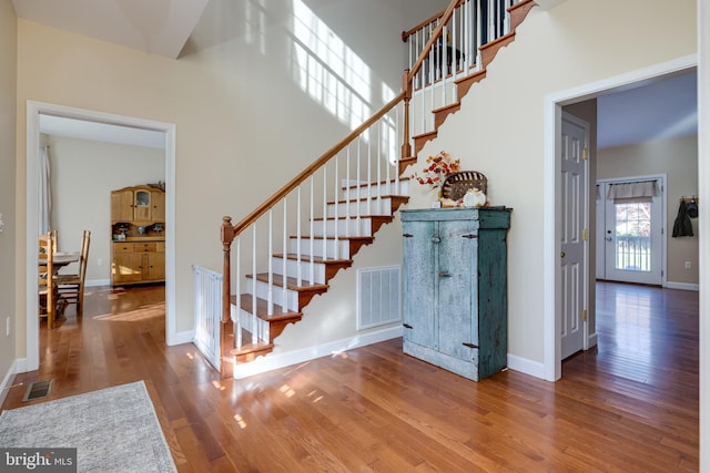 stairs with hardwood / wood-style flooring