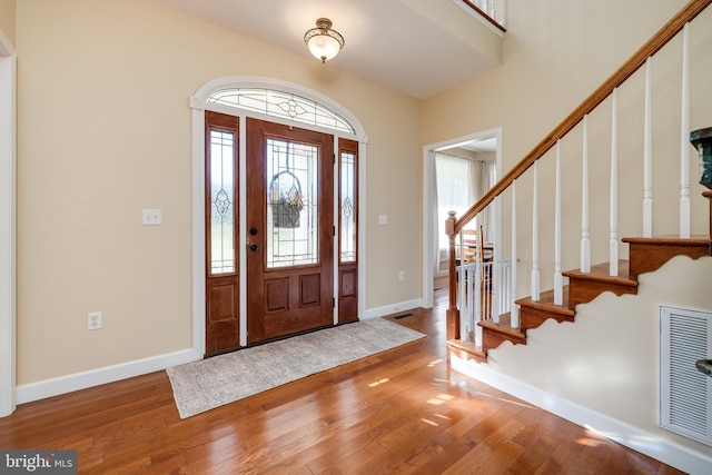 entrance foyer with hardwood / wood-style floors