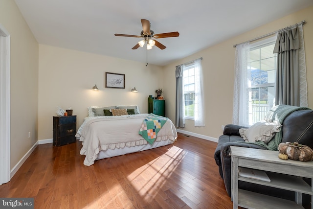 bedroom featuring hardwood / wood-style flooring and ceiling fan