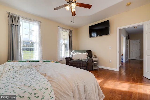 bedroom with wood-type flooring and ceiling fan