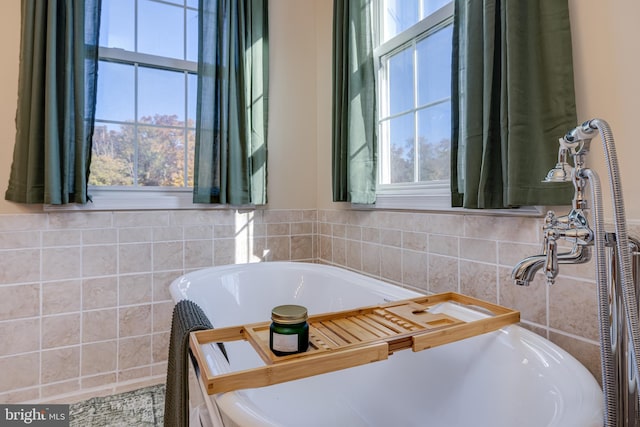 bathroom with a tub to relax in