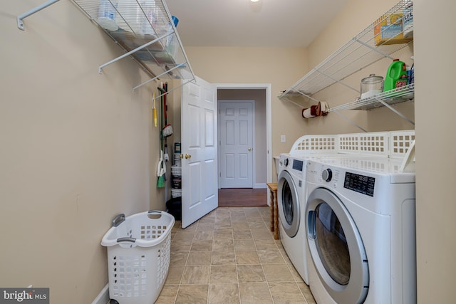 washroom with washer and dryer