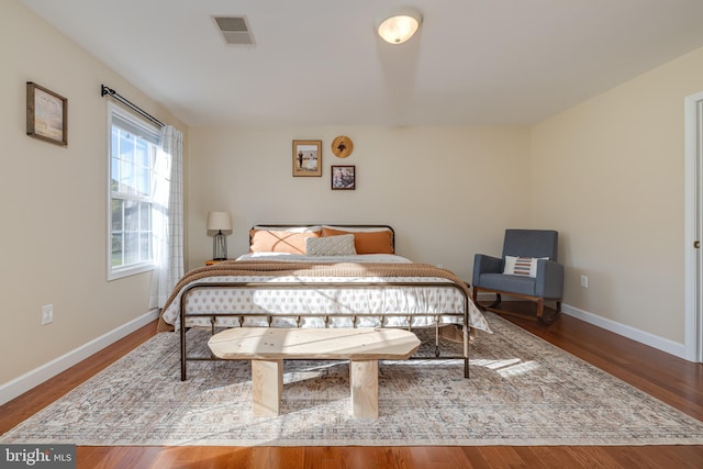 bedroom with hardwood / wood-style floors