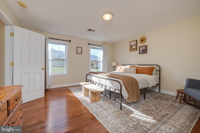 bedroom featuring dark hardwood / wood-style flooring