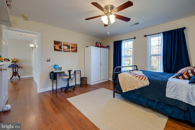 bedroom featuring wood-type flooring and ceiling fan