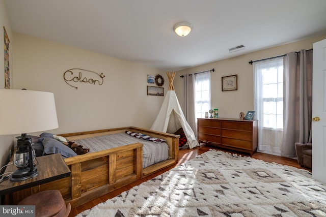 bedroom with wood-type flooring