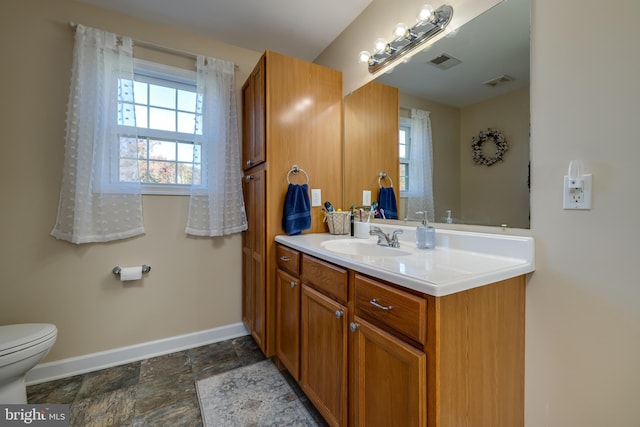 bathroom with vanity and toilet