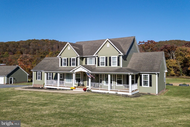 view of front of property featuring a front yard and covered porch