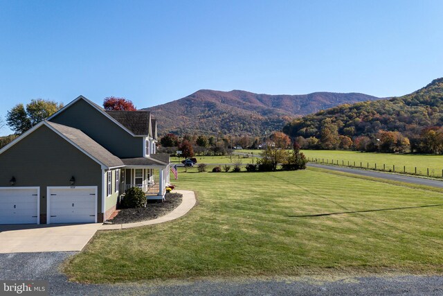 mountain view featuring a rural view