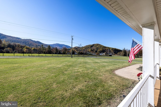 view of yard featuring a mountain view and a rural view