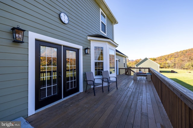 wooden terrace with a mountain view