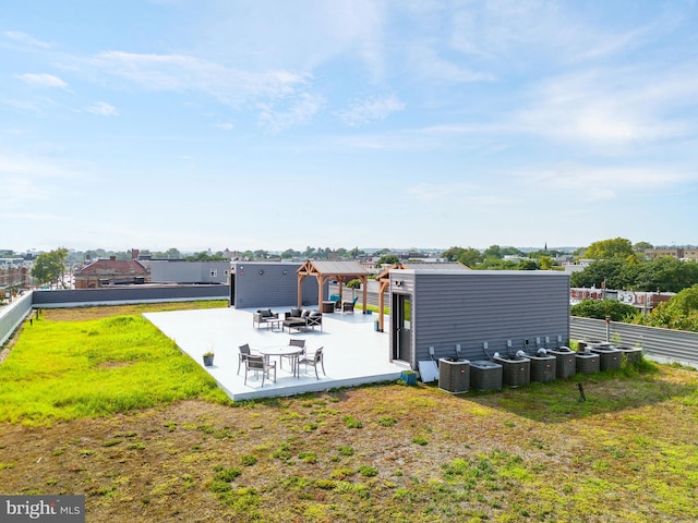 back of property featuring a yard and a patio area