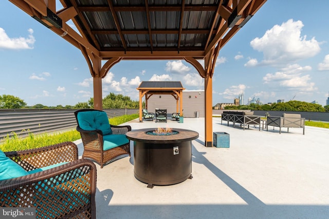 view of patio with a gazebo and an outdoor fire pit