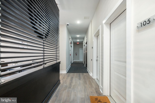 corridor featuring hardwood / wood-style flooring