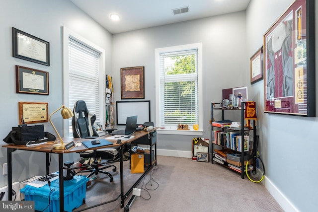 office space with light colored carpet