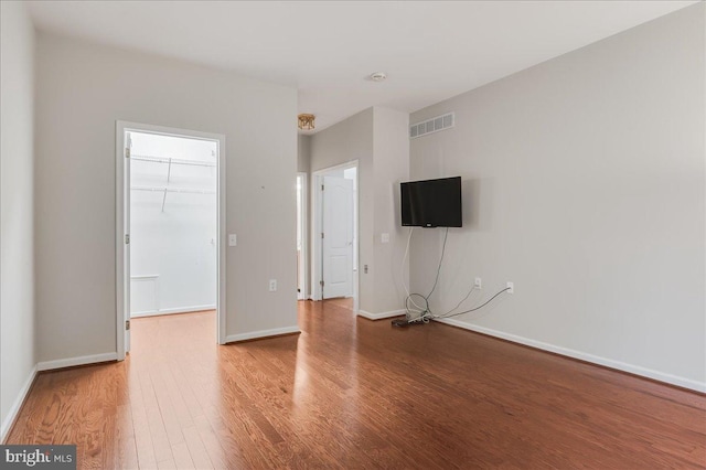 spare room with wood-type flooring