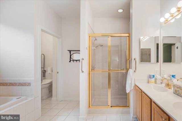 full bathroom with vanity, toilet, tile patterned flooring, and plus walk in shower