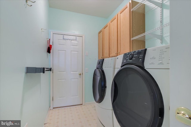 laundry room with cabinets and separate washer and dryer