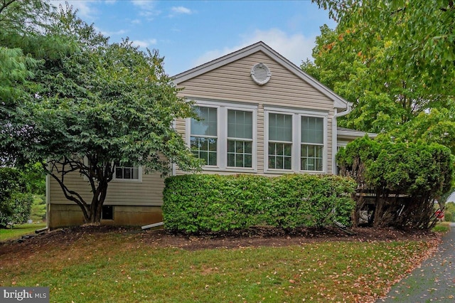 view of home's exterior featuring a lawn