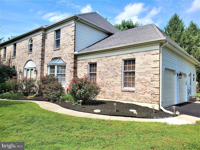 view of property exterior with a garage and a yard