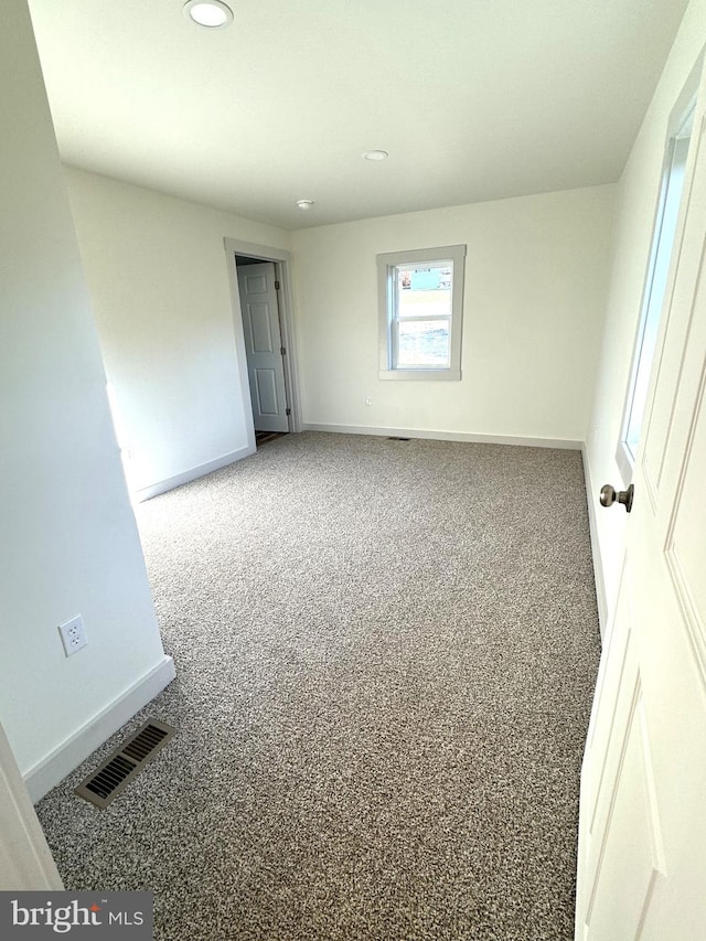 empty room featuring carpet flooring