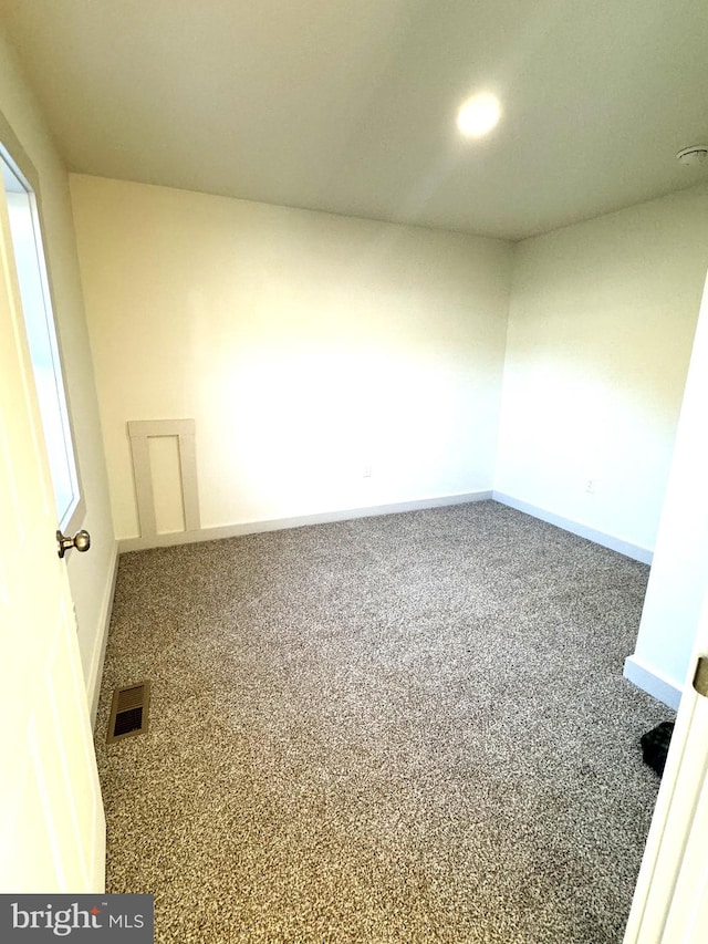 unfurnished room featuring carpet flooring